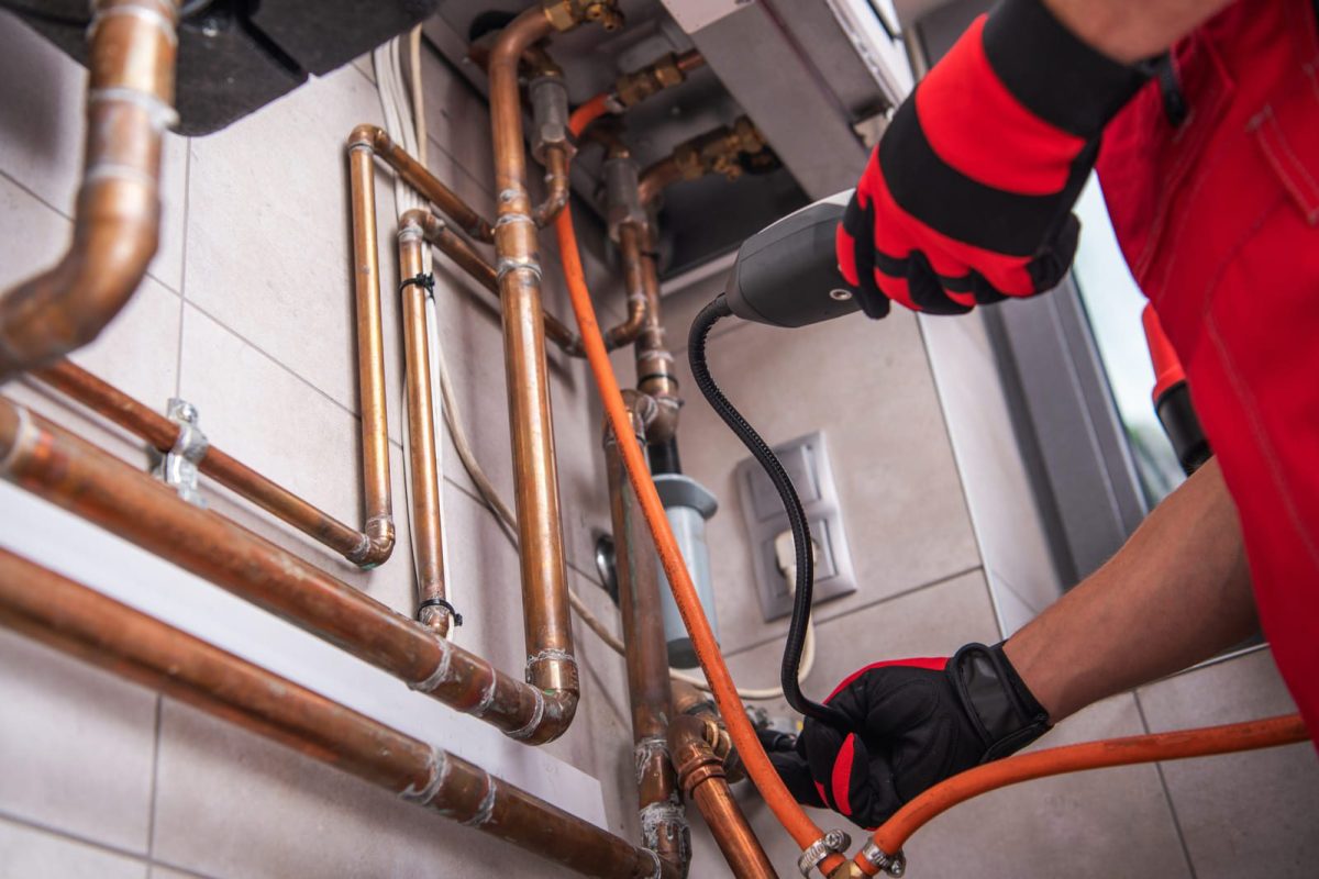 hvac-worker-with-natural-gas-detector-2023-11-27-05-19-31-utc