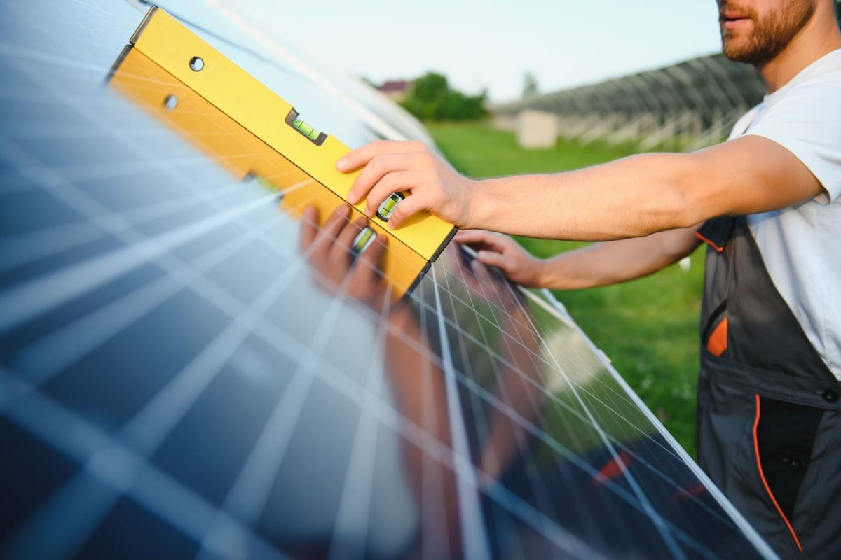 man-engineer-in-uniform-working-on-solar-panels-po-2023-11-28-02-28-19-utc
